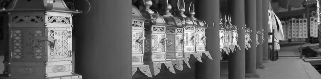 A row of metallic lanterns at a Shino shrine.